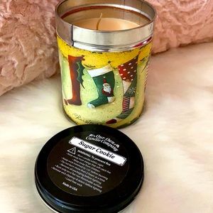 Sugar cookie candle in tin.